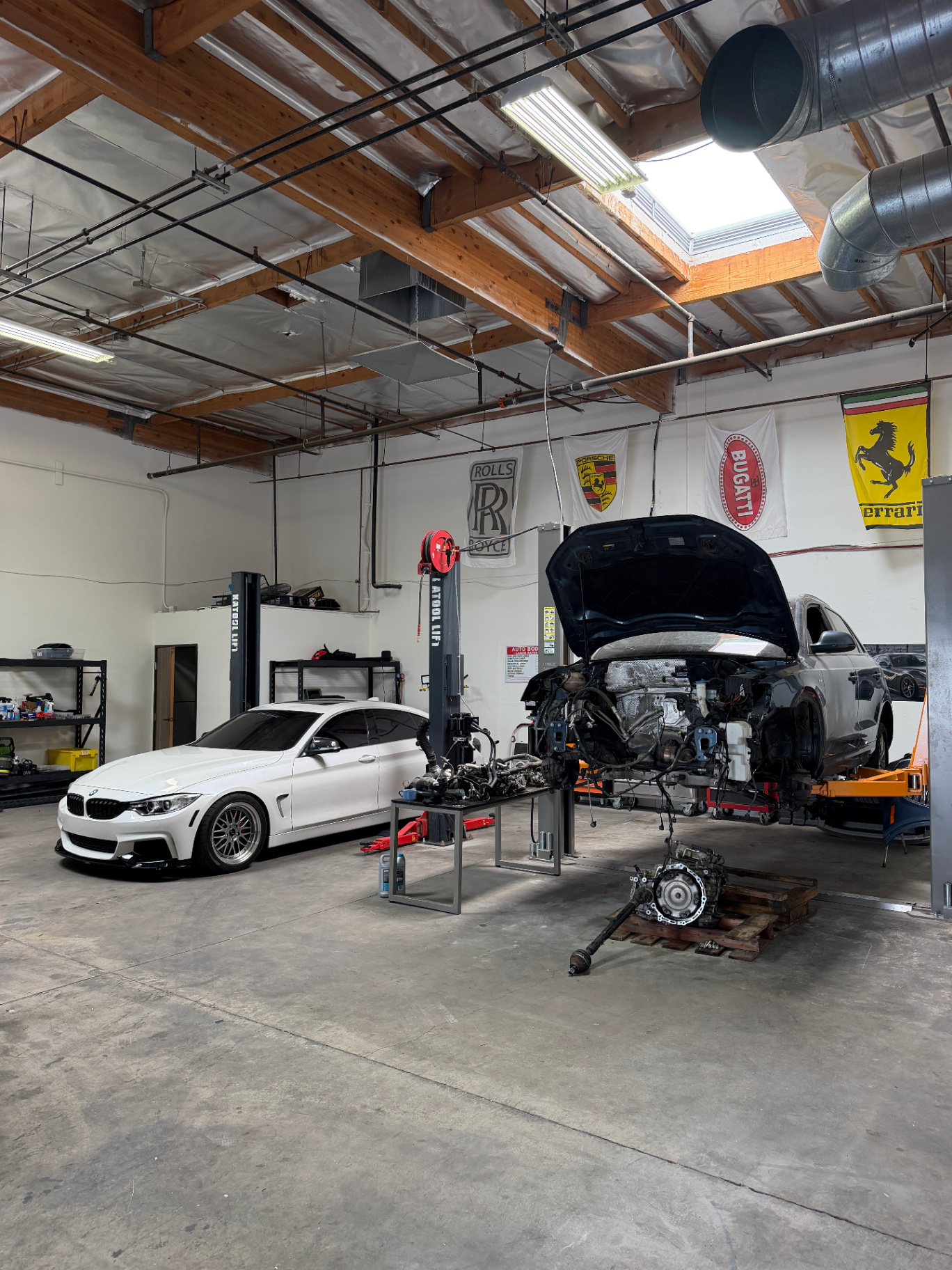 Engine and transmission teardown in progress in the RPM Motors bay